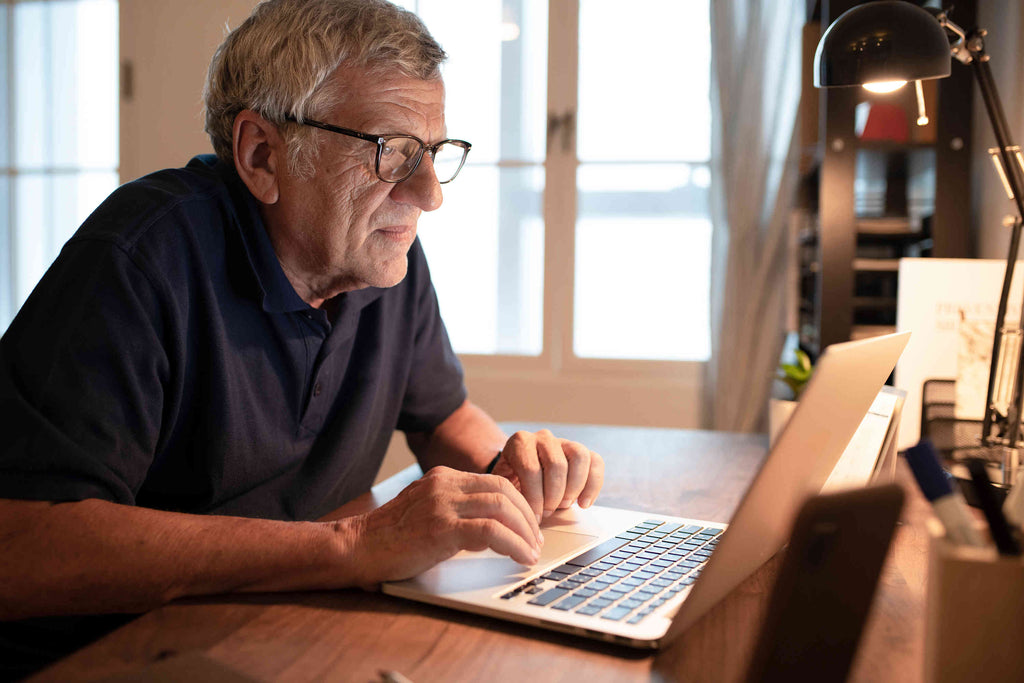 Older Man Working on a Laptop